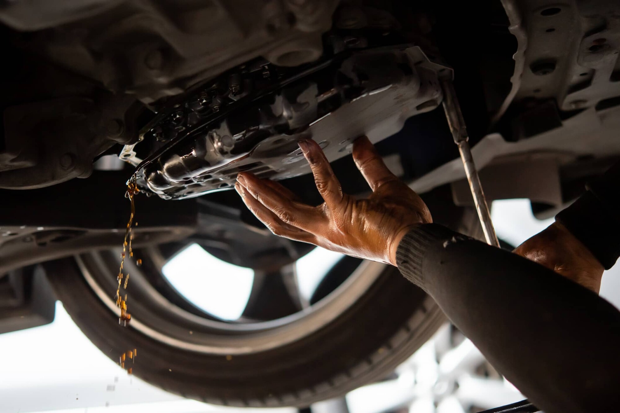 Transmission fluid drain from underside of vehicle