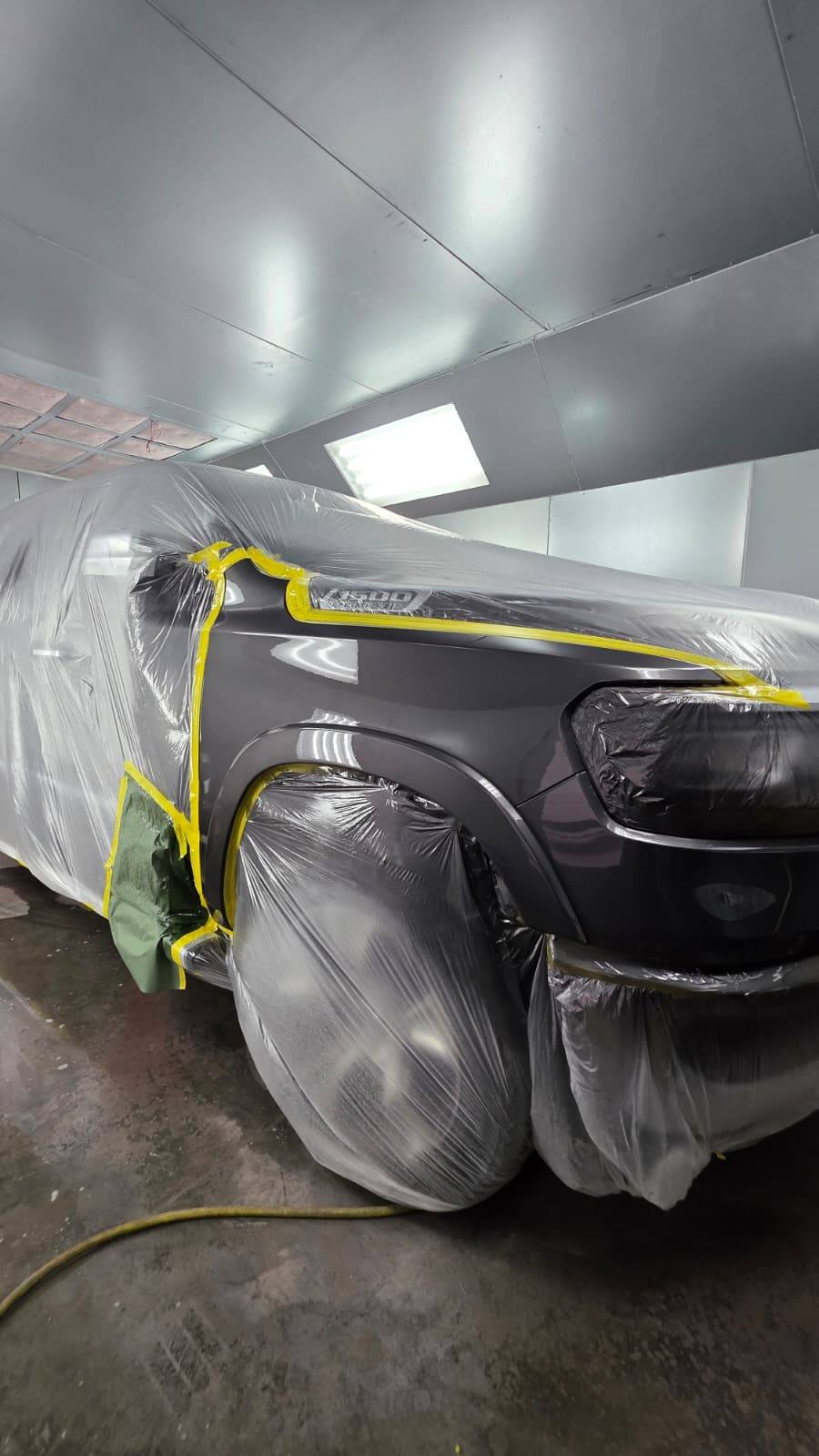 Dark RAM truck fully masked and prepped for paint